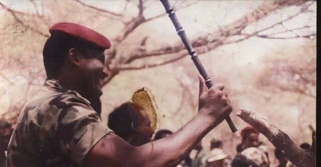 عبد الرحمن الصادق المهدي بالزي العسكري يحمل بندقية | Abdelrahman Al Sadiq Al Mahdi in uniform carrying a rifle