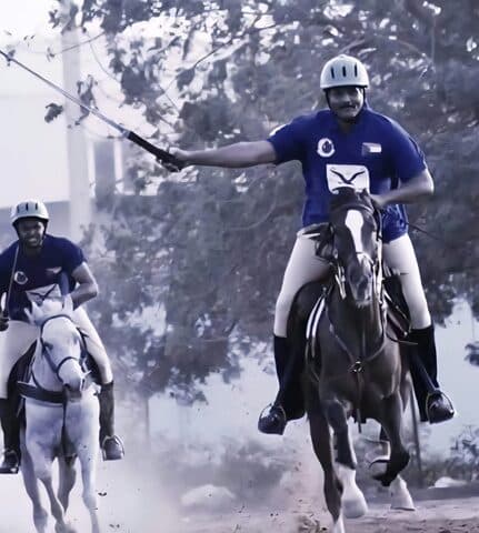 عبد الرحمن الصادق المهدي على جواده يحمل مضرب البولو | Abdelrahman Al Sadiq Al Mahdi on horseback holding a polo mallet